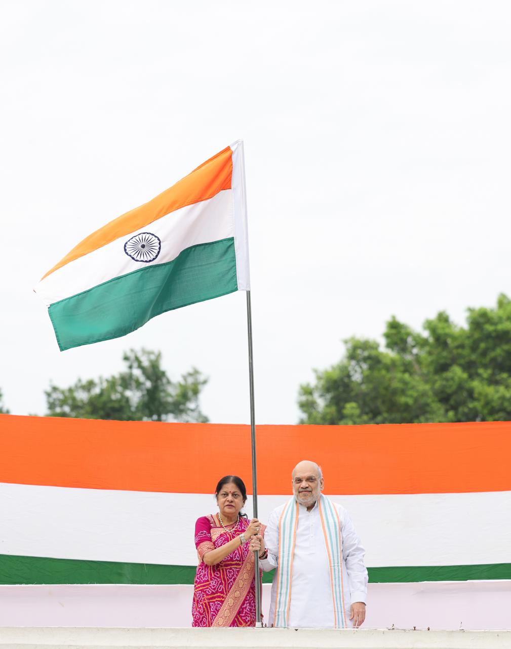 Shri Amit Shah hoists Tiranga at his residence in New Delhi, under #HarGharTiranga campaign.